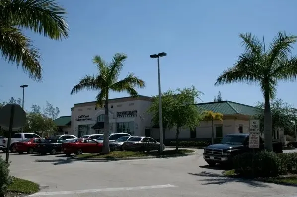 Commercial seamless gutter installation on a Southwest Florida building